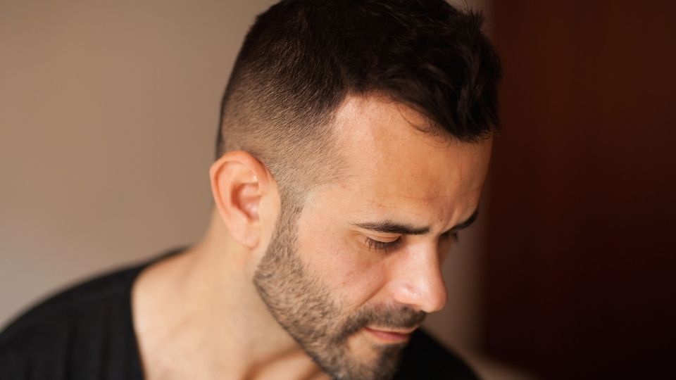 heroin withdrawal symptoms affect a man as he considers treatment.